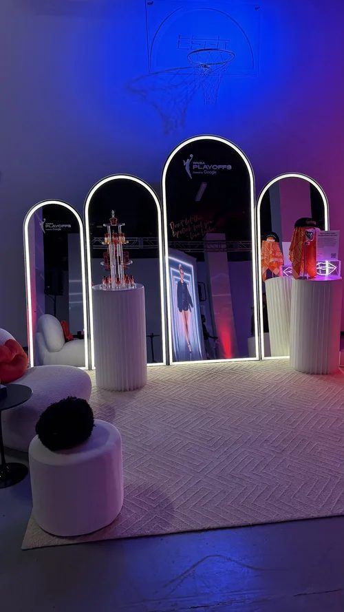 Mirrored arches and a lit display at the House of ESPN x WNBA activation